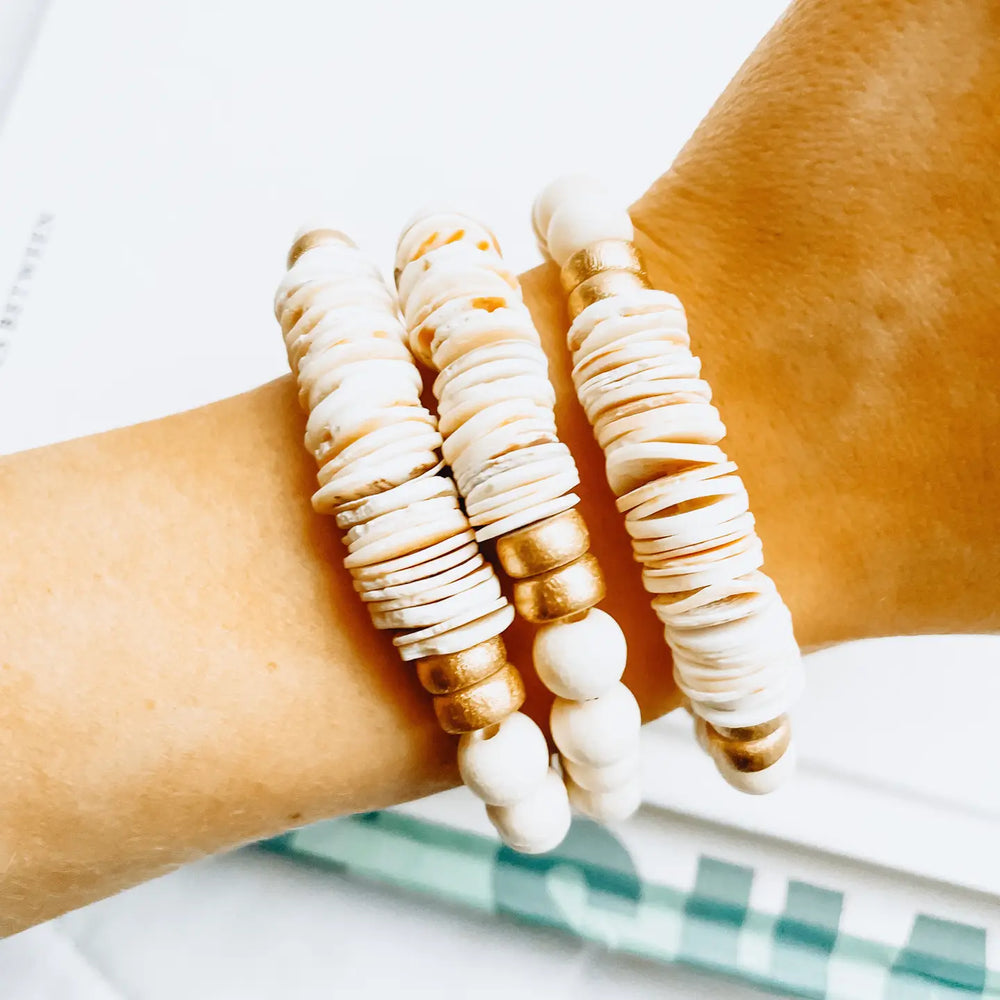 
                      
                        Person wearing the Seashell Stacking Bracelet from Forever Faye
                      
                    