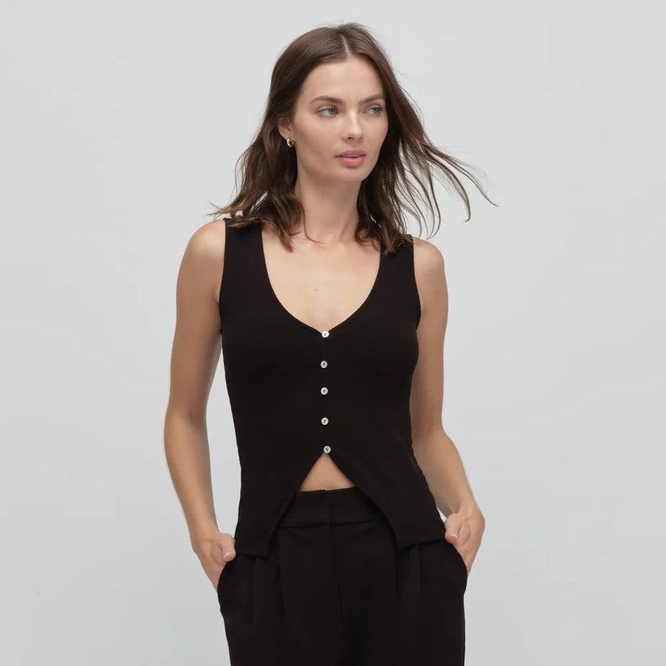 Woman wearing a black sleeveless top from Favorite Daughter