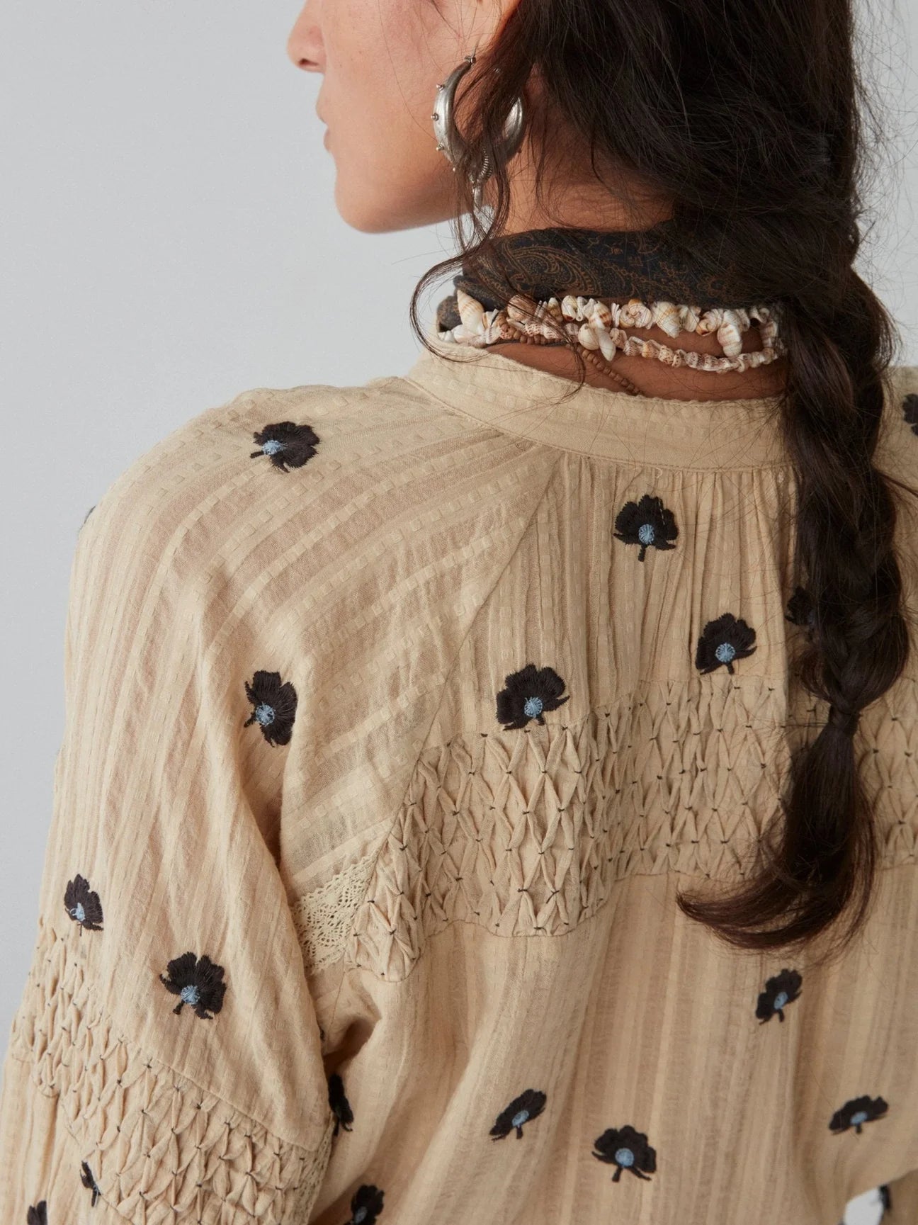 Back design detail on the Geranium Ivory Fleur Blouse by Maison Hotel