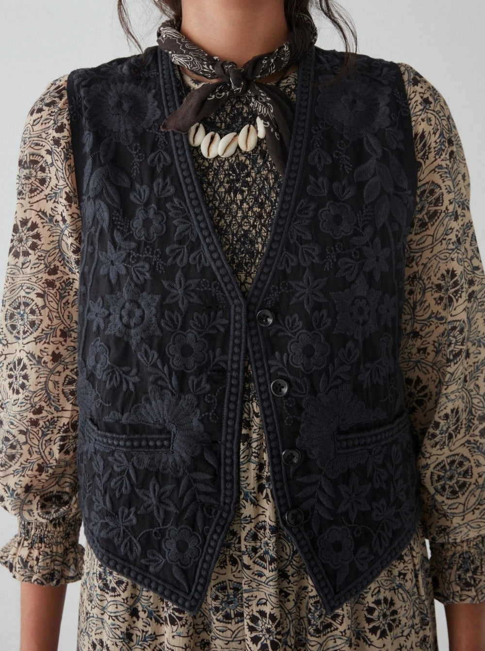 Front view of a woman wearing the embroidered Freddie Vest in the color Blue Orchid by the brand Maison Hotel 