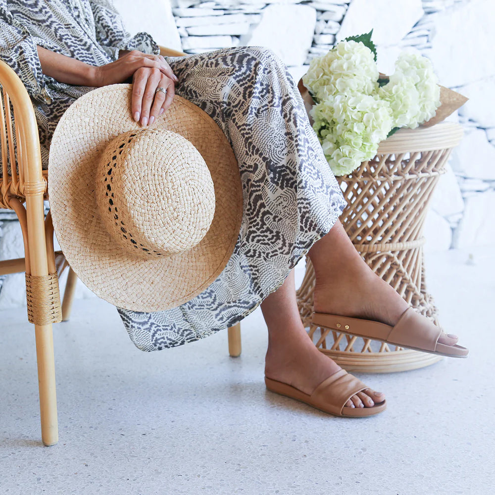 A woman wearing the Gallito Leather Slide Sandals by beek