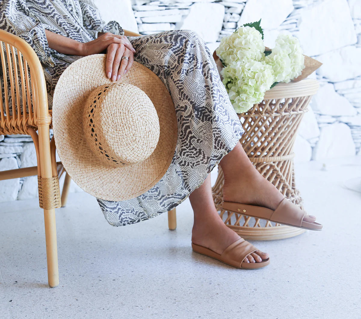 A woman wearing the Gallito Leather Slide Sandals by beek