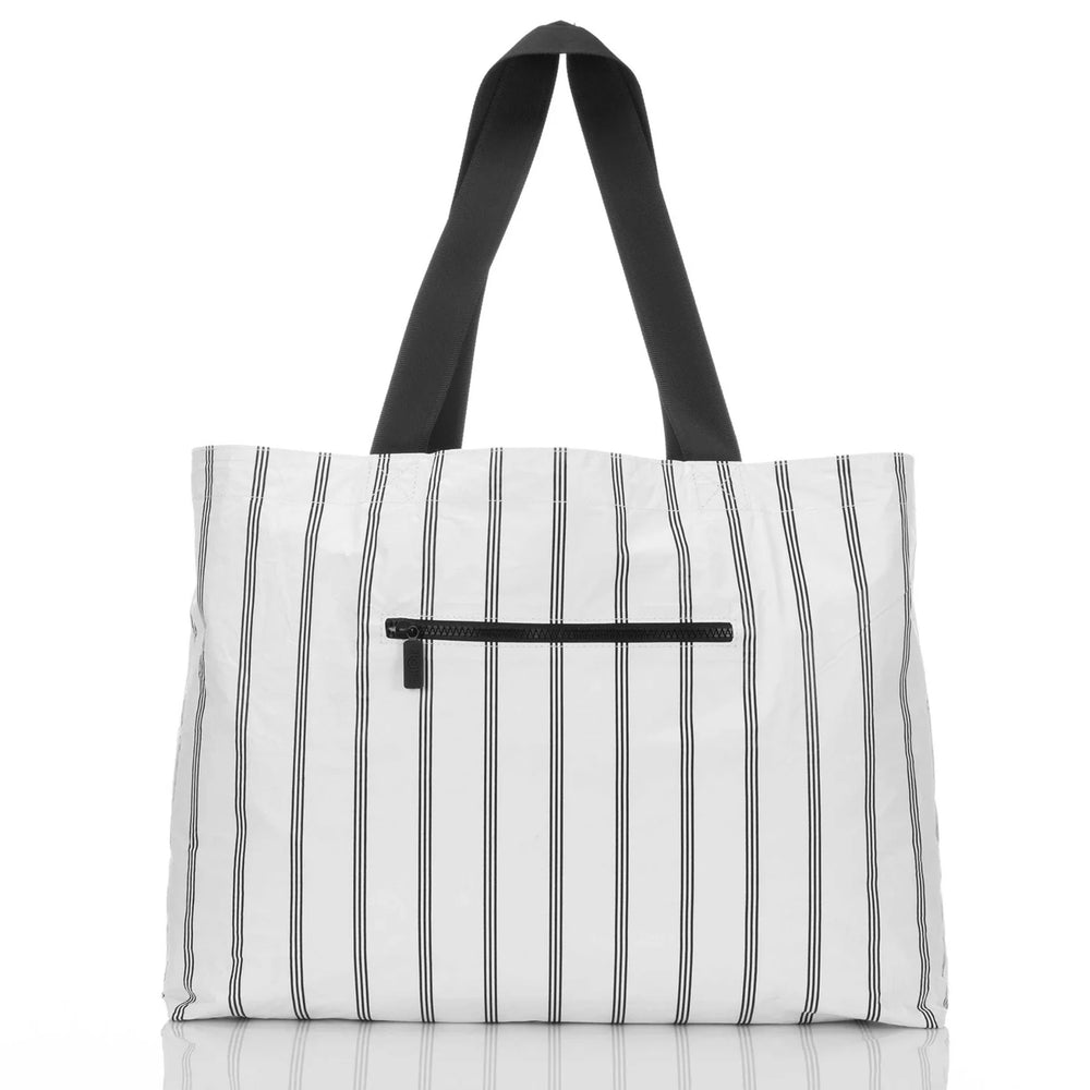 
                      
                        Black and white striped view of the reversible Seaside Holo Holo carryall bag by Aloha Collection 
                      
                    