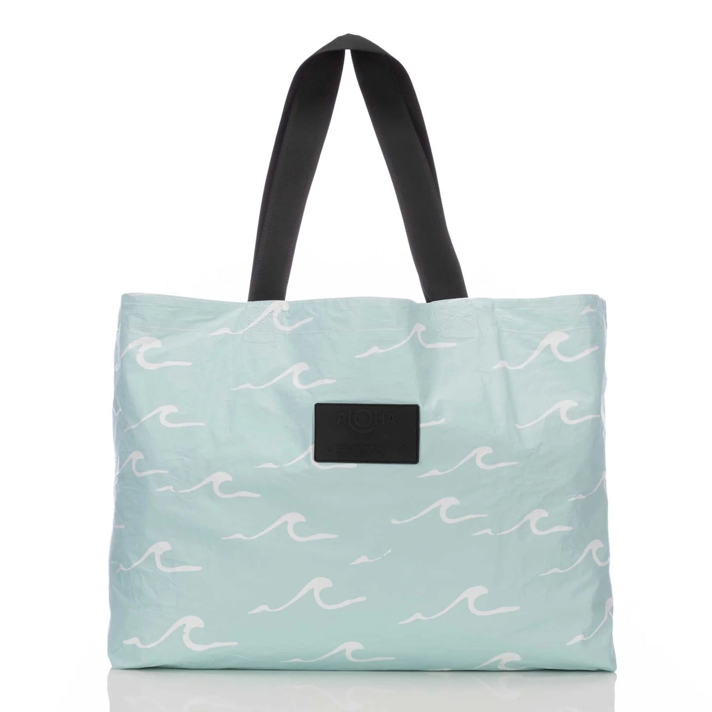 Blue wave design view of the reversible Seaside Holo Holo carryall bag by Aloha Collection 