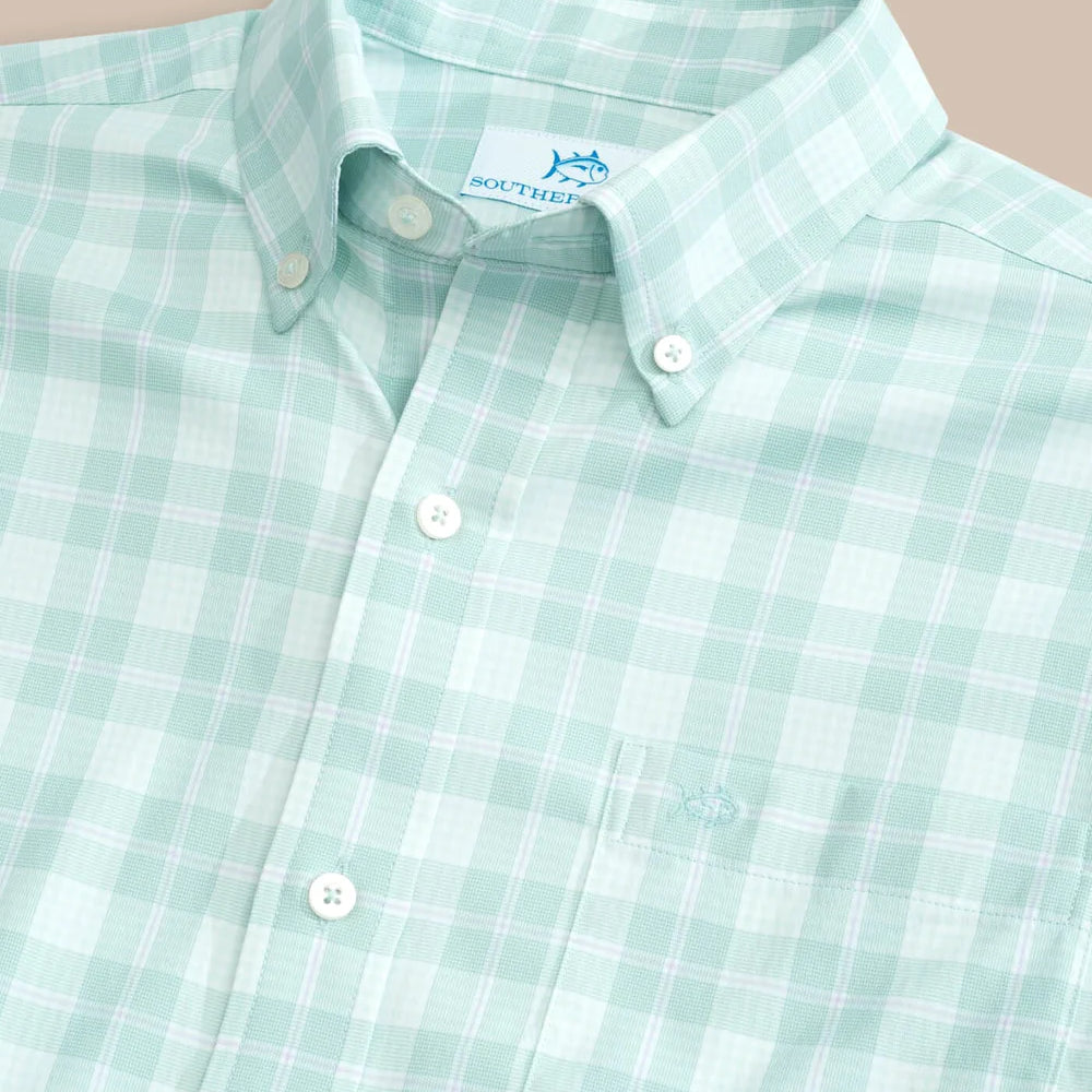 
                      
                        Closeup view of a long sleeve plaid men's shirt
                      
                    
