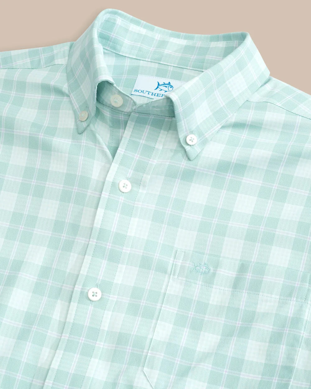 Closeup view of a long sleeve plaid men's shirt