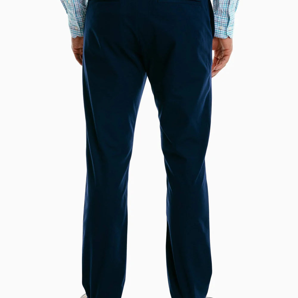 
                      
                        Back view of a man wearing the navy Jack Performance Pants by Southern Tide
                      
                    