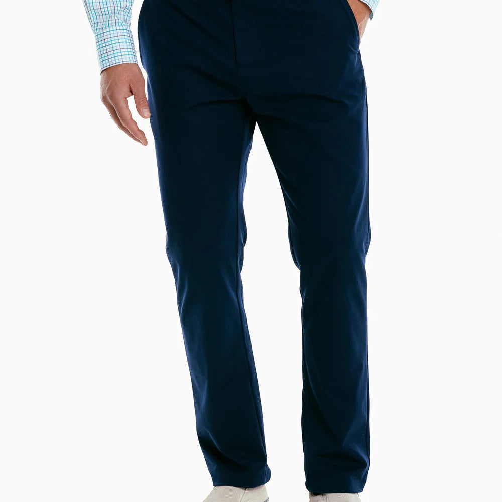 Front view of a man wearing the navy Jack Performance Pants by Southern Tide