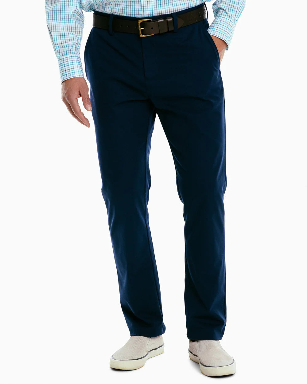 Front view of a man wearing the navy Jack Performance Pants by Southern Tide