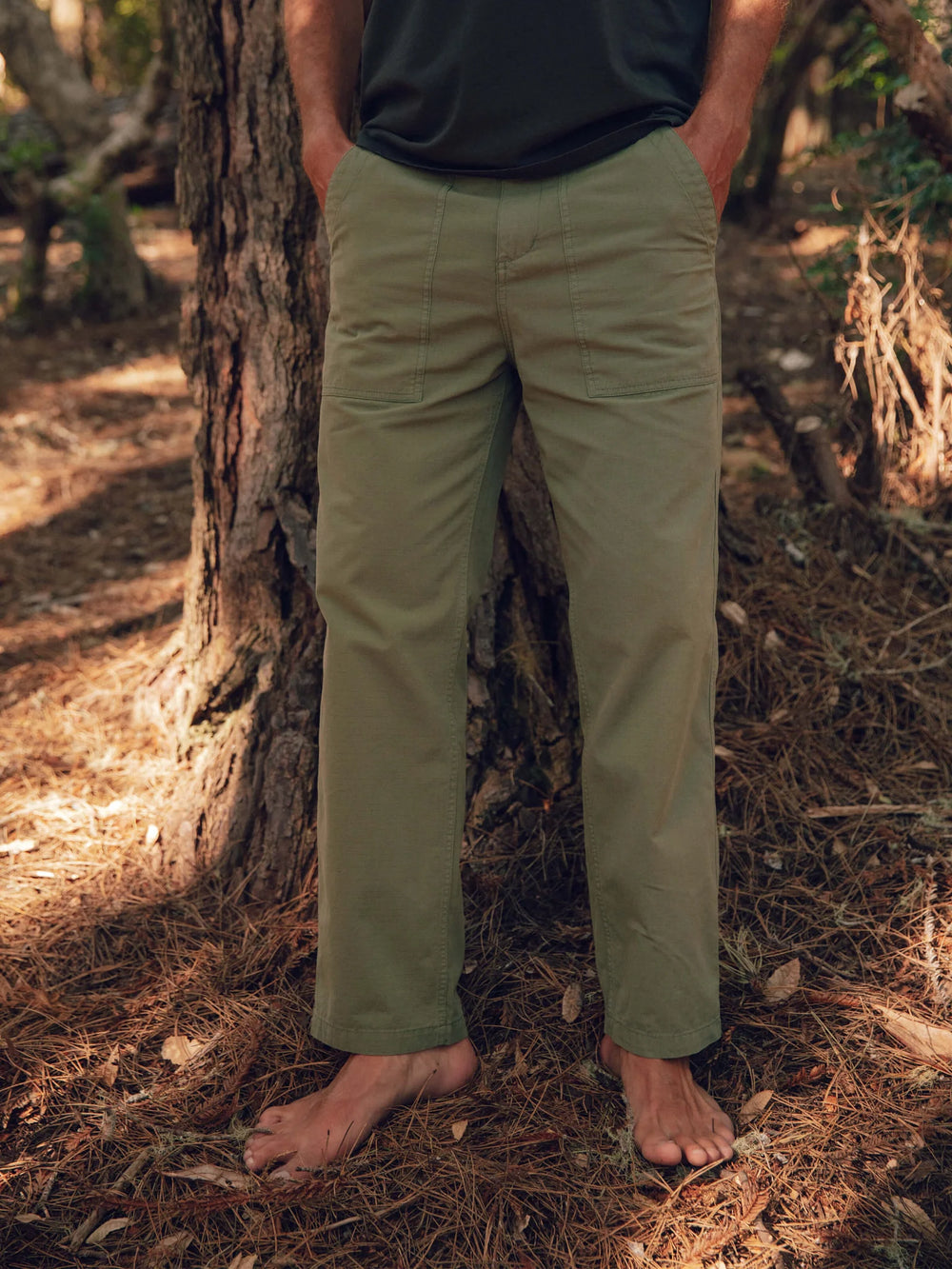 Front view of men's relaxed fit green pants