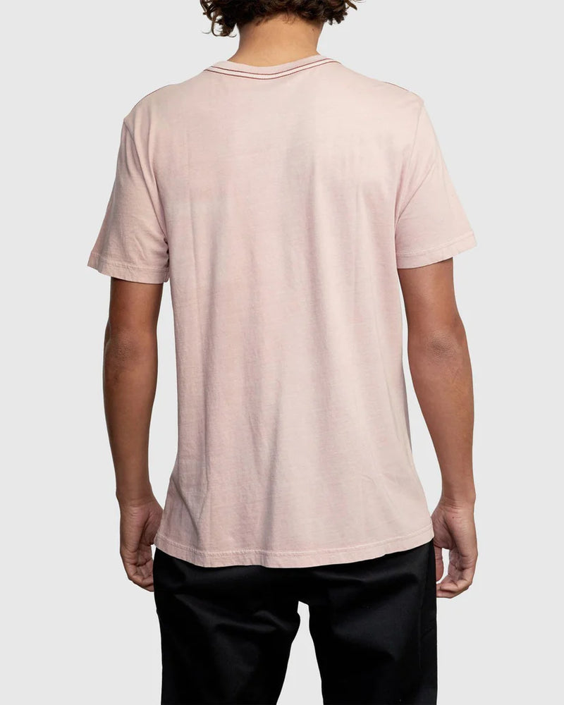 
                      
                        Man wearing a light pink short sleeve pocket tee from RVCA
                      
                    