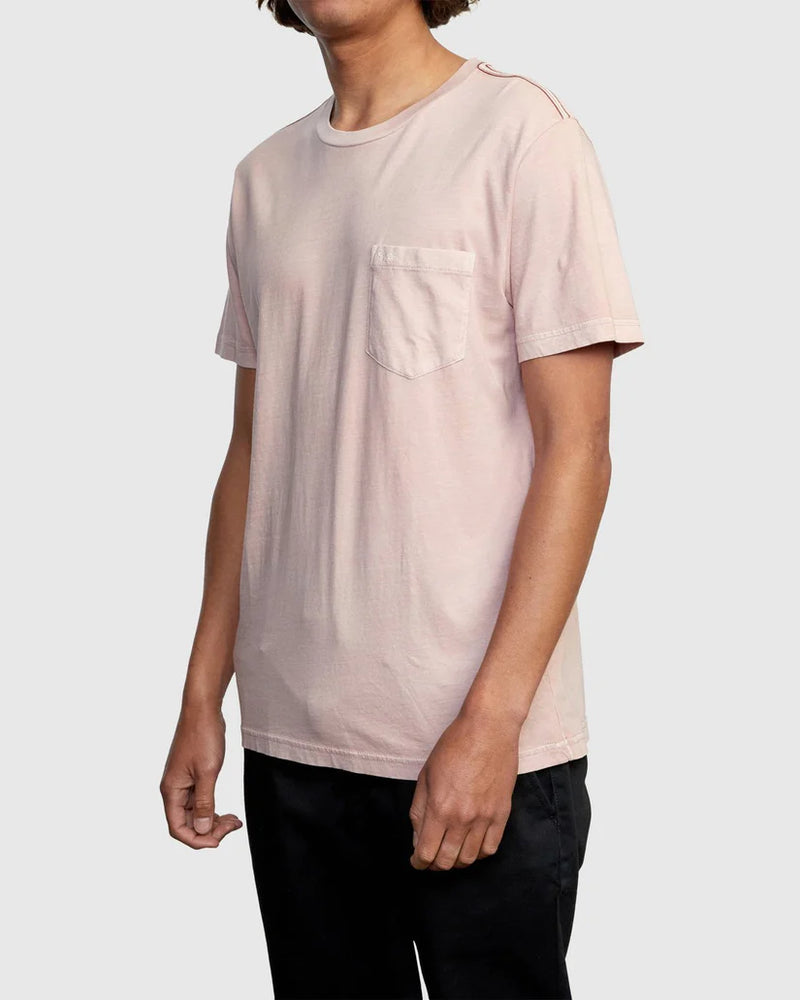 
                      
                        Man wearing a light pink short sleeve pocket tee from RVCA
                      
                    