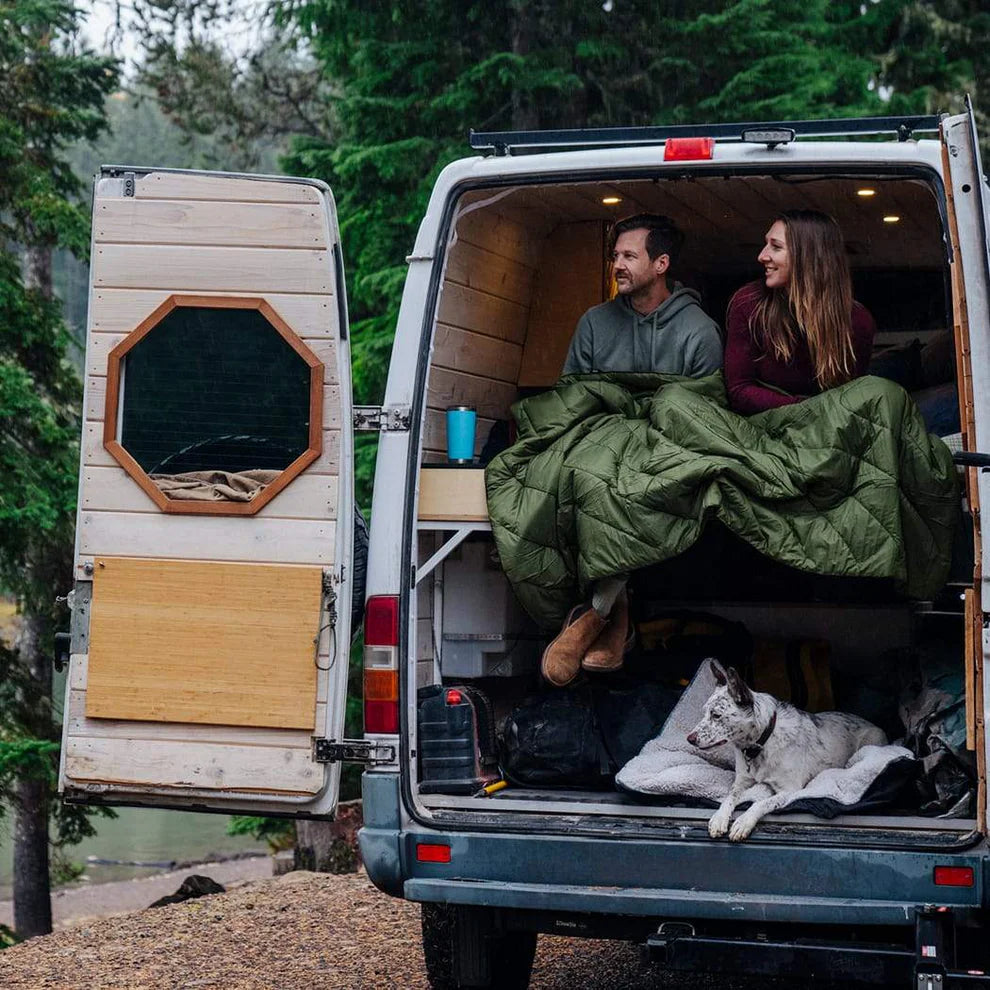 People using Rumpl's Original Puffy Blanket (1 Person) in the color Cypress