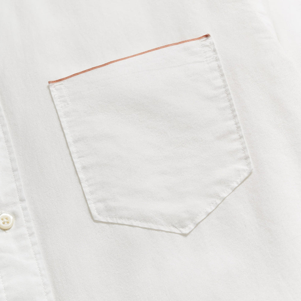 
                      
                        Close up view of the chest pocket on a men's white button down shirt by Billy Reid
                      
                    
