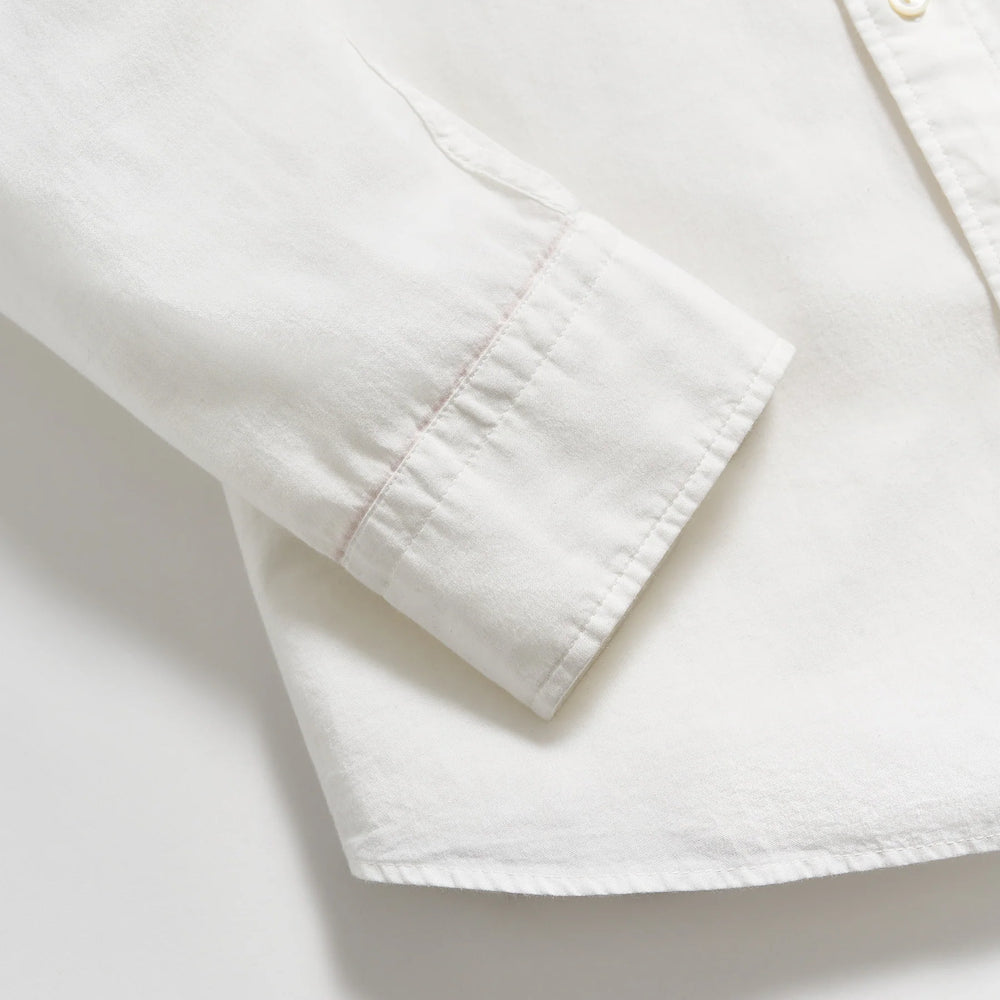 
                      
                        Close up view of sleeve cuffs on a men's white button down shirt by Billy Reid
                      
                    