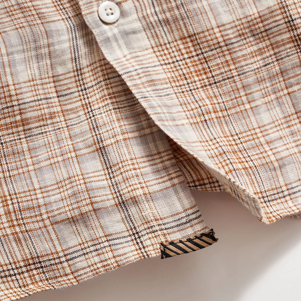 
                      
                        Front button detail view of Billy Reid's Linen Line Plaid Wilson Shirt
                      
                    