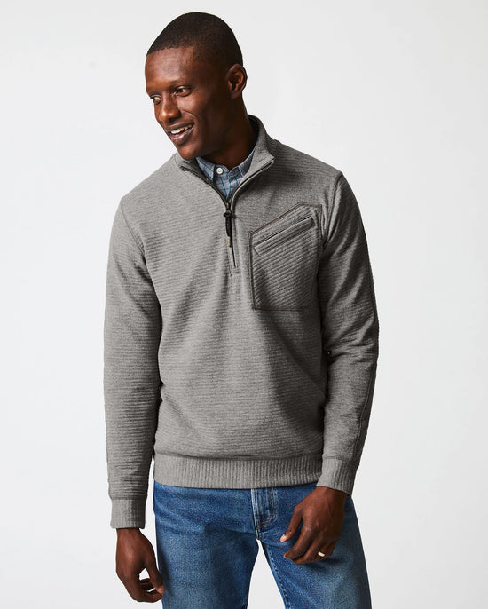 Front view of man wearing a grey quilted half zip pullover sweater by Billy Reid