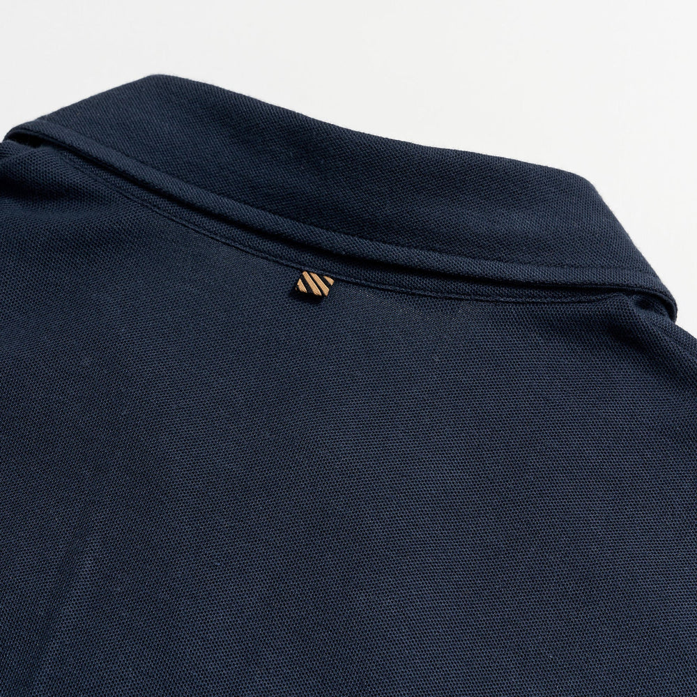 
                      
                        Back flat lay view of  a dark blue short sleeve polo shirt by Billy Reid
                      
                    