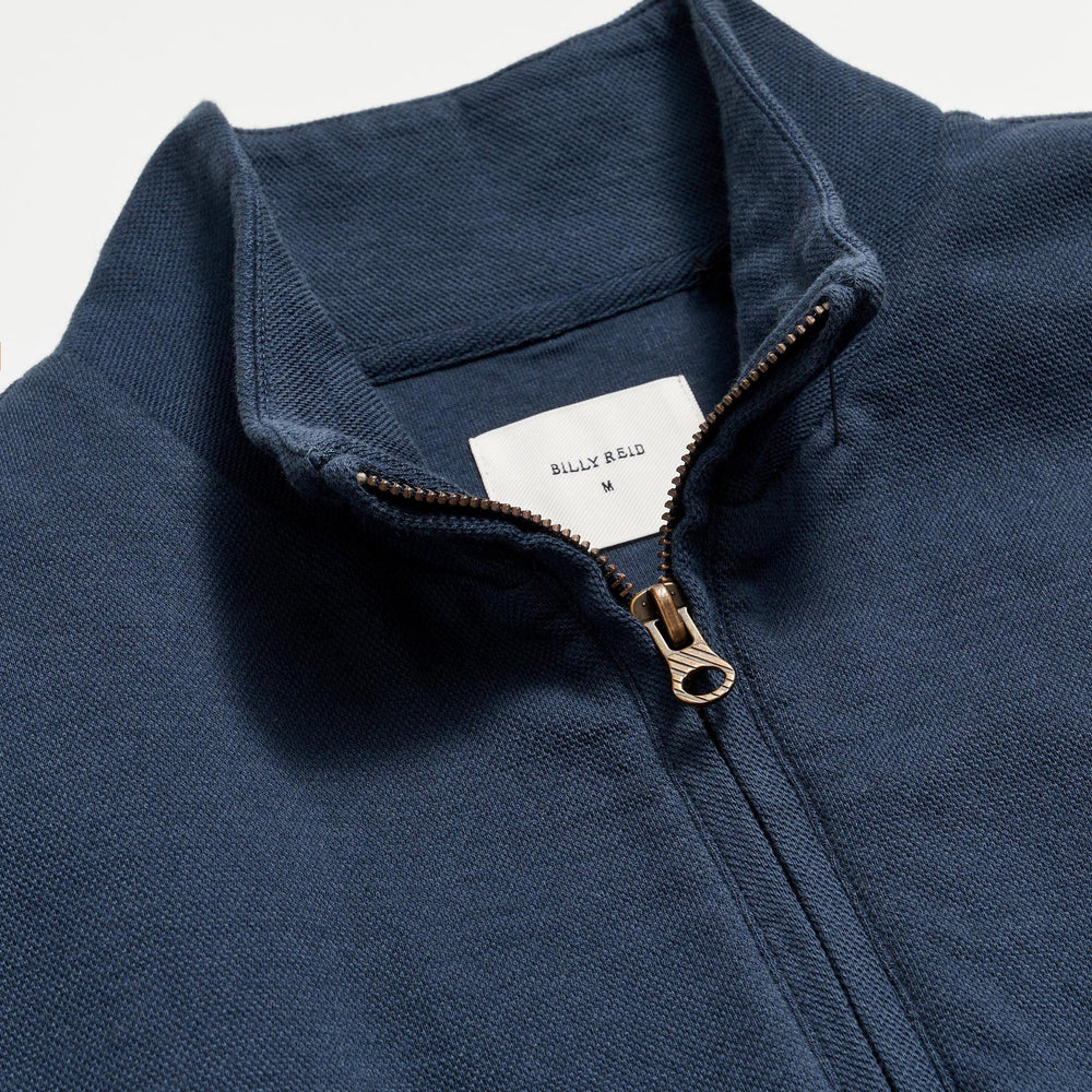 
                      
                        Neckline detail  view of Billy Reid's Cullman Half Zip in the color Navy
                      
                    