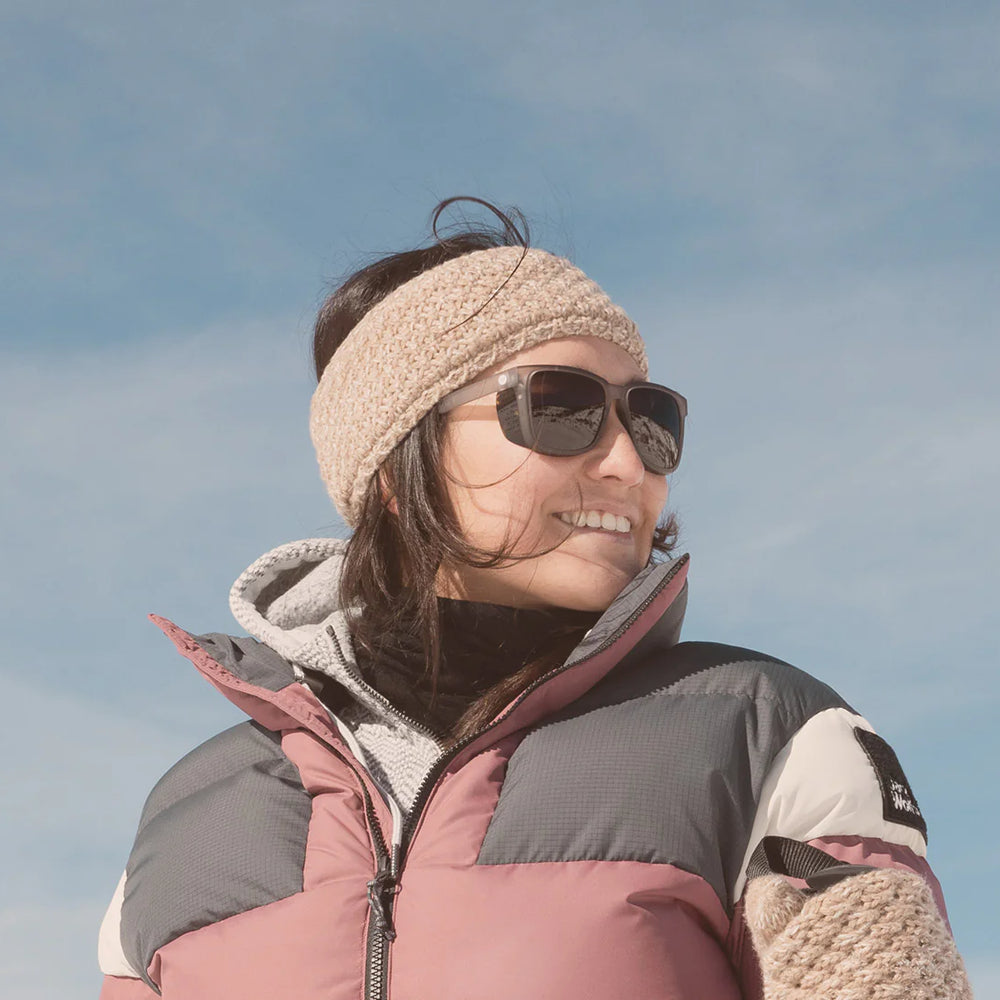 
                      
                        Woman wearing the Mist Amber Couloir Sunglasses by Sunski
                      
                    