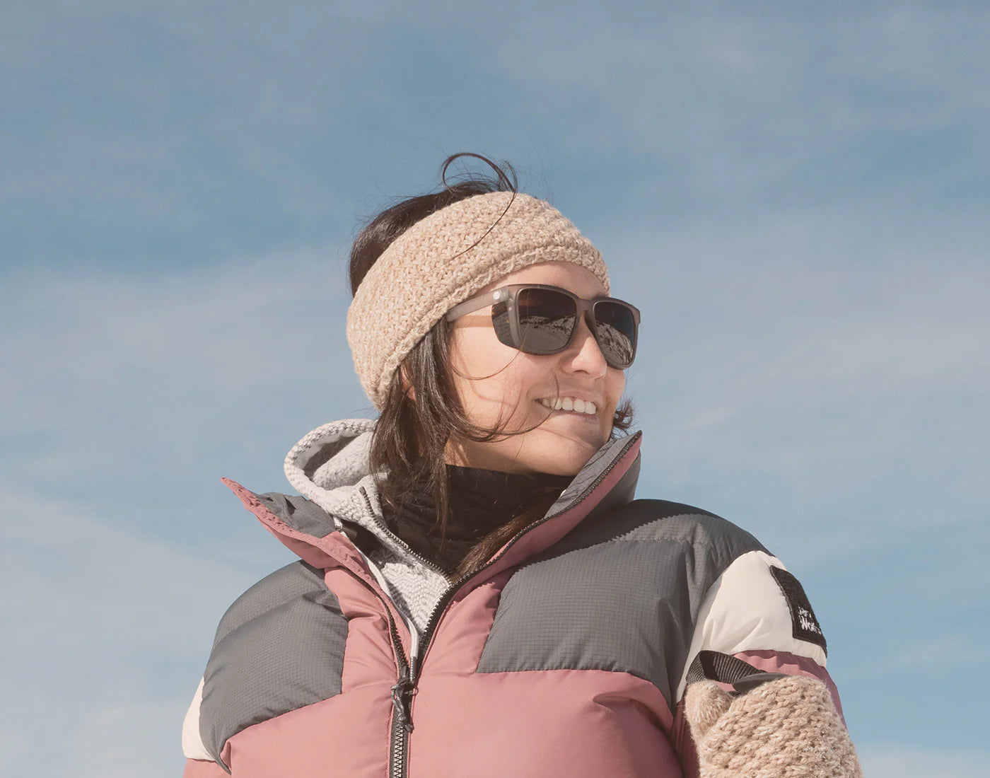 Woman wearing the Mist Amber Couloir Sunglasses by Sunski