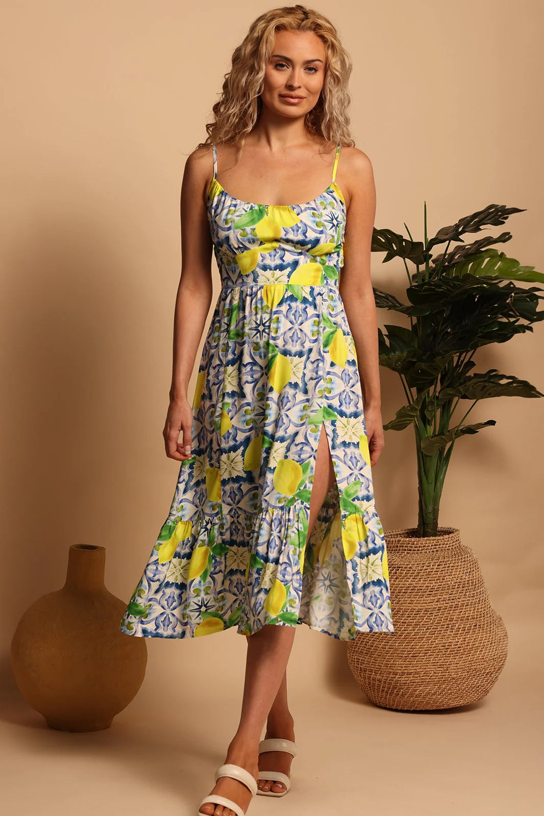 Front view of a woman wearing the Capri Lemons Sydney Midi Dress by Shore