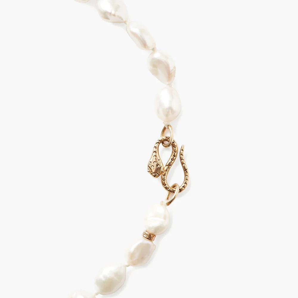 
                      
                        Snake clasp detail on Chan Luu's White Keshi Pearl Cobra Necklace
                      
                    