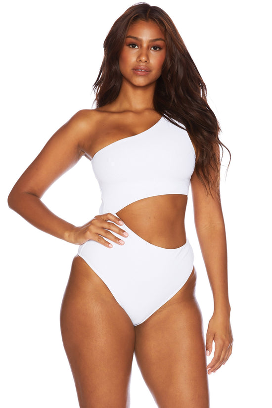 front view of woman wearing a white, asymmetrical one shoulder one piece swimsuit with a side cutout detail.