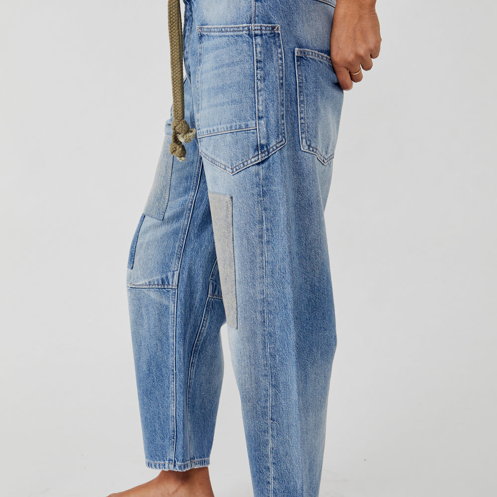 
                      
                        Side view of Free People's Moxie Low Slung Pull-On Barrel Jeans in the color Truest Blue
                      
                    