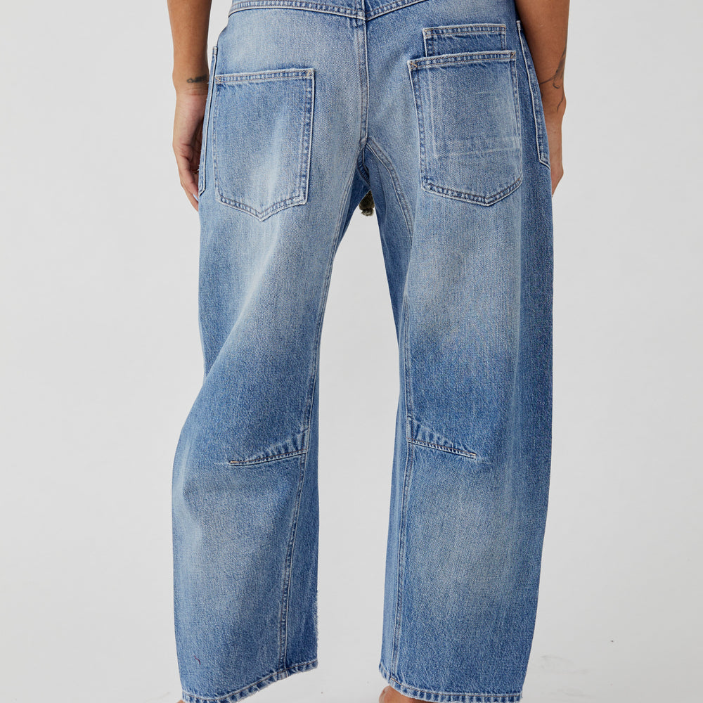 
                      
                        Back view of Free People's Moxie Low Slung Pull-On Barrel Jeans in the color Truest Blue
                      
                    