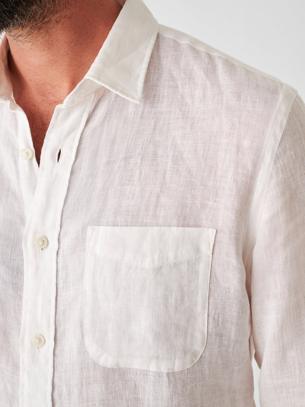 Detail view on the front of Faherty's Linen Laguna Shirt in the color White