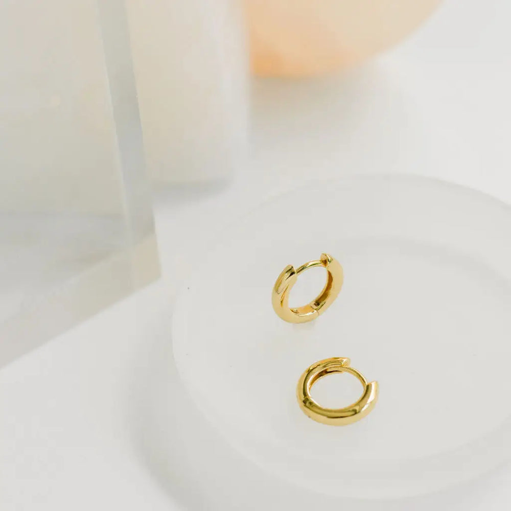 The Classic Gold Huggie Hoop Earrings by The Land Of Salt